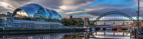 View of a bridge and blue and white building in Newcastle