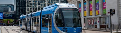 A tram outside The Exchange building in Birmingham